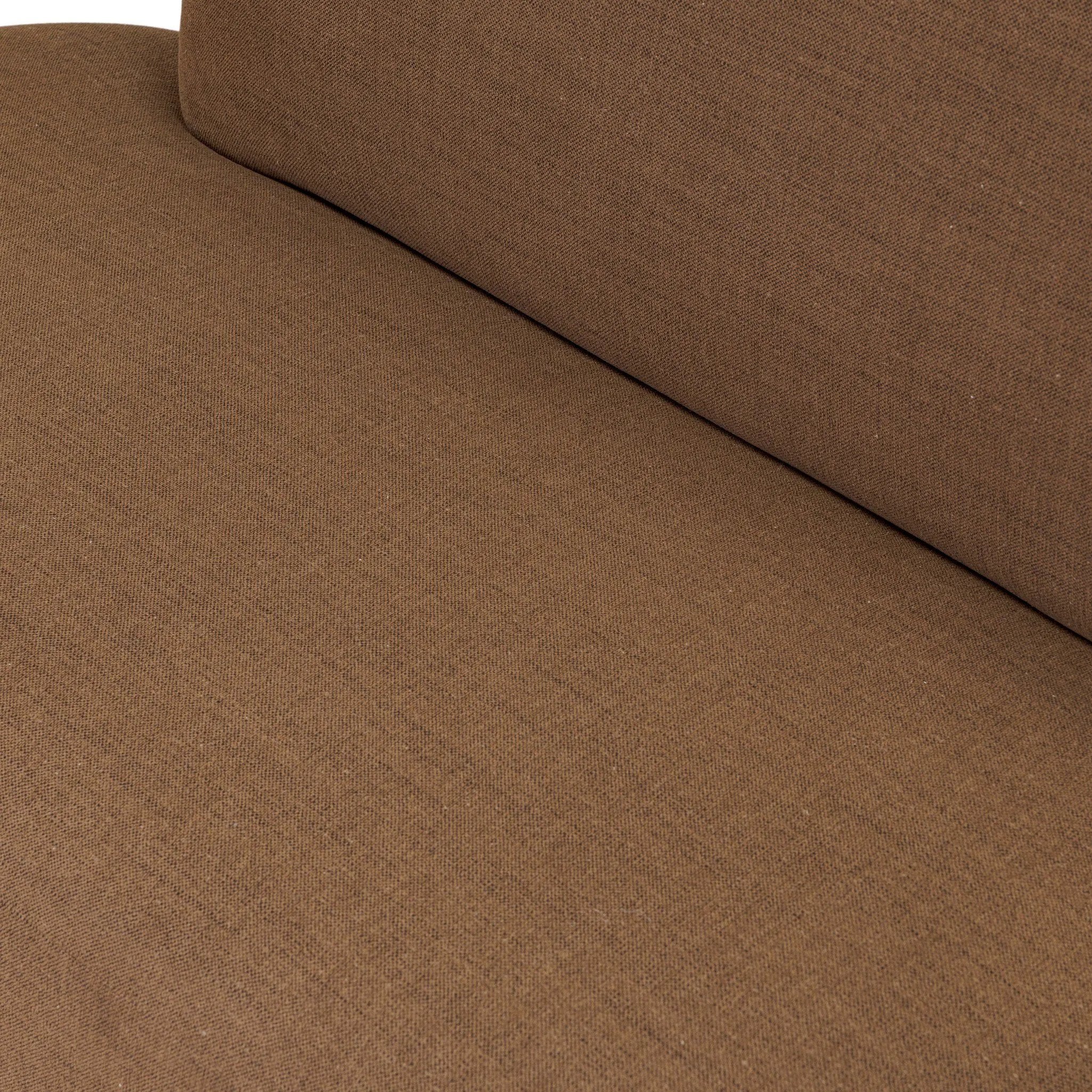 Dramatically shaped and tightly tailored, this rounded dining banquette features soft angles all around. Upholstered in a ver