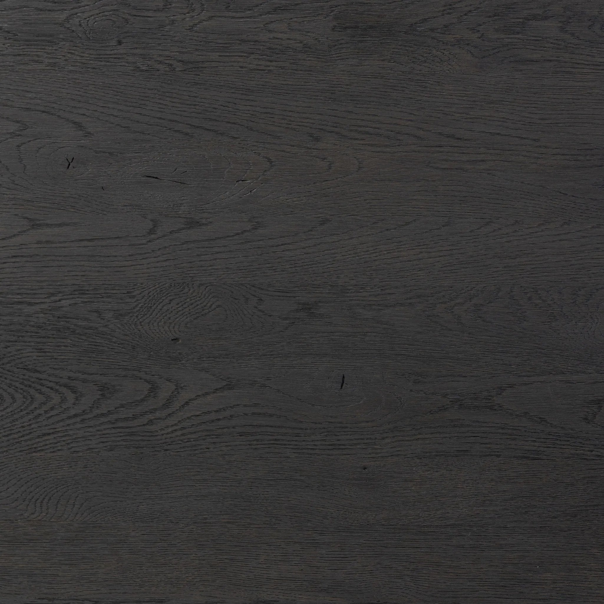 Bring a beautifully contoured look to your workspace with a desk inspired by Italian postmodernism. Connected by iron brackets, a dual-panel base supports a spacious tabletop of worn black oak, crafting a float-like look. Four drawers keep frequently used items within reach Amethyst Home provides interior design, new home construction design consulting, vintage area rugs, and lighting in the Seattle metro area.