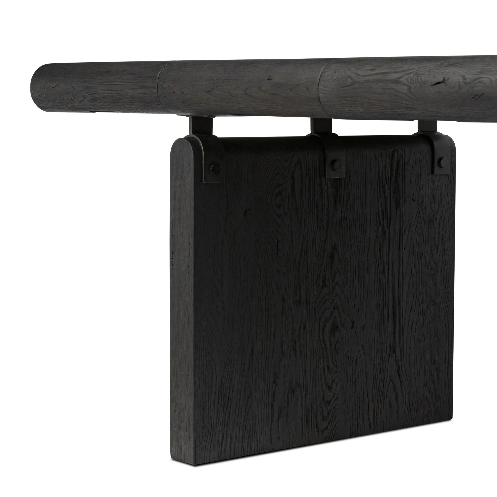 Bring a beautifully contoured look to your workspace with a desk inspired by Italian postmodernism. Connected by iron brackets, a dual-panel base supports a spacious tabletop of worn black oak, crafting a float-like look. Four drawers keep frequently used items within reach Amethyst Home provides interior design, new home construction design consulting, vintage area rugs, and lighting in the Tampa metro area.