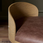 Featuring Cloris Palermo Cigar Swivel Bar + Counter Stool by Four Hands at Amethyst Home. Channel vintage vibes with a swivel stool perfectly sized for the bar. Crafted of blonde-finished oak, a low, molded back adds a playful touch, while a top-grain leather seat offers luxe comfort. Finished off with a memory swivel to ensure the stool's curved wood back . Amethyst Home provides interior design, new home construction design consulting, vintage area rugs, and lighting in the San Diego metro area.