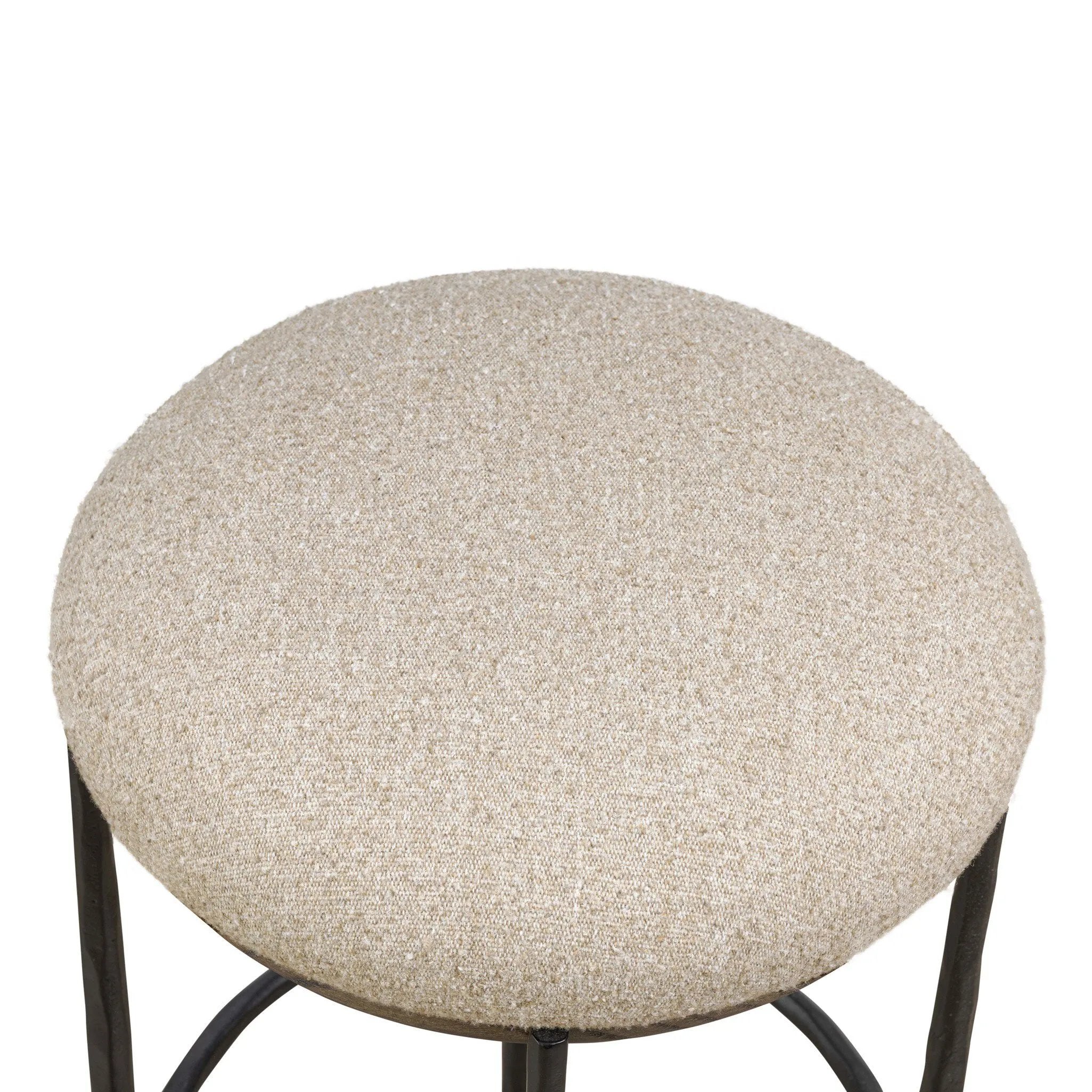 Contrasting materials come together to create an elevated counter stool. Designed with tapered cast iron legs and a solid oak