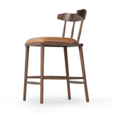 Featuring Colter Chaps Saddle Counter Stool by Four Hands at Amethyst Home. Made from solid ash with a vintage finish, this versatile counter stool pairs an airy back with tapered spindles, for a simple, inviting look. A fixed upholstered seat of top-grain leather adds a smart, comfortable touch.Overall Dimensions: 20.50"w x 22.75"d x 38.25"hWeight : 13.23 lbsM. Amethyst Home provides interior design, new home construction design consulting, vintage area rugs, and lighting in the Miami metro area.