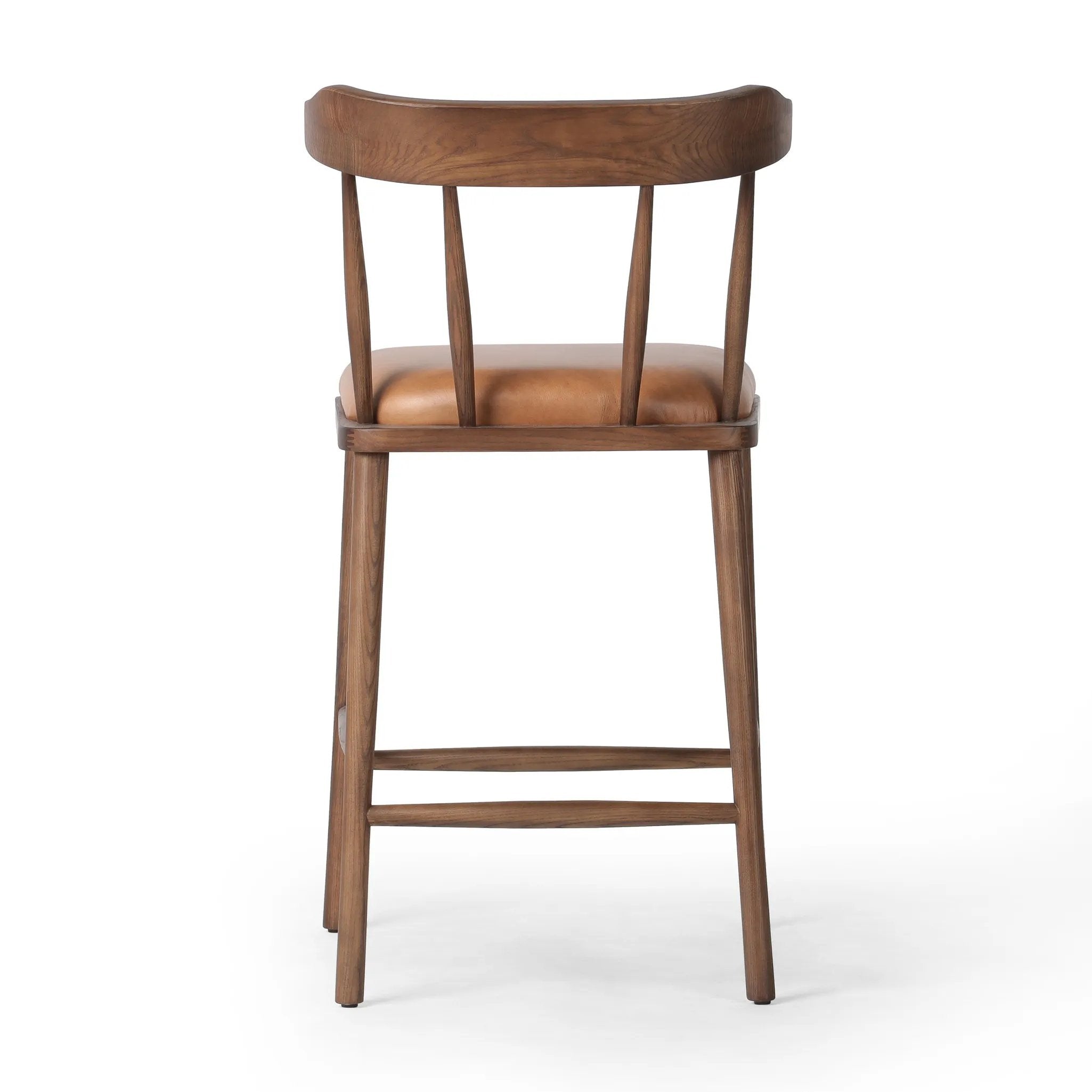 Featuring Colter Chaps Saddle Counter Stool by Four Hands at Amethyst Home. Made from solid ash with a vintage finish, this versatile counter stool pairs an airy back with tapered spindles, for a simple, inviting look. A fixed upholstered seat of top-grain leather adds a smart, comfortable touch.Overall Dimensions: 20.50"w x 22.75"d x 38.25"hWeight : 13.23 lbsM. Amethyst Home provides interior design, new home construction design consulting, vintage area rugs, and lighting in the Omaha metro area.