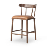 Featuring Colter Chaps Saddle Counter Stool by Four Hands at Amethyst Home. Made from solid ash with a vintage finish, this versatile counter stool pairs an airy back with tapered spindles, for a simple, inviting look. A fixed upholstered seat of top-grain leather adds a smart, comfortable touch.Overall Dimensions: 20.50"w x 22.75"d x 38.25"hWeight : 13.23. Amethyst Home provides interior design, new home construction design consulting, vintage area rugs, and lighting in the Washington metro area.