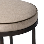 Featuring Corinne Alcala Taupe Bar + Counter Stool by Four Hands at Amethyst Home. Hammered iron legs with ball-shaped foot details elevate this simply shaped bar stool. A round, cushioned seat upholstered in performance fabric offers a clean, inviting look. Performance fabrics are specially created to withstand spills, stains, high traffic and wear, ensuri. Amethyst Home provides interior design, new home construction design consulting, vintage area rugs, and lighting in the Charlotte metro area.