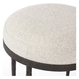 Featuring Corinne Crete Pebble Accent Stool by Four Hands at Amethyst Home. Work midcentury vibes into any space with a pared-back accent stool that doubles as a cocktail ottoman. Wrough iron legs finished in a hammered bronze pair with a simple rounded seat upholstered in a texture-rich fabric, with S-spring suspension for comfort and structure.Overall Dimensi. Amethyst Home provides interior design, new home construction design consulting, vintage area rugs, and lighting in the Miami metro area.
