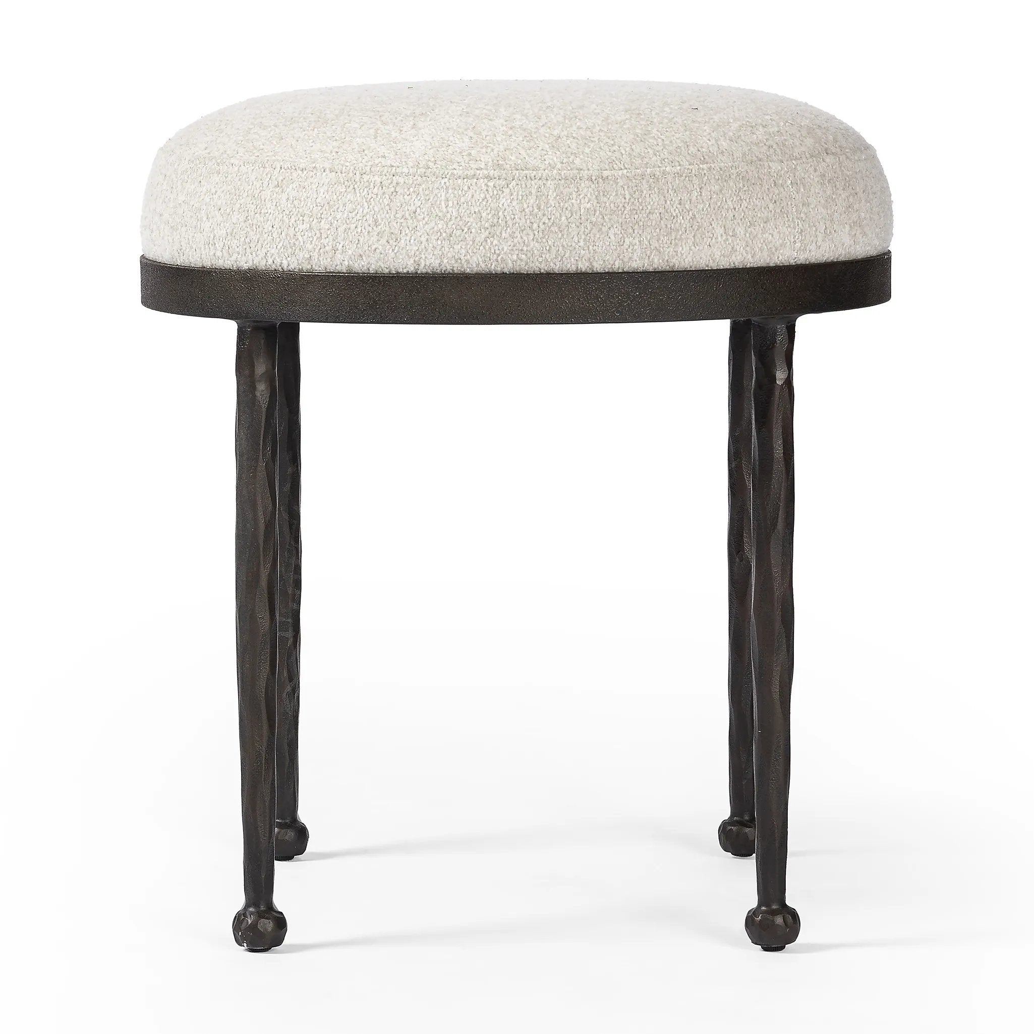 Featuring Corinne Crete Pebble Accent Stool by Four Hands at Amethyst Home. Work midcentury vibes into any space with a pared-back accent stool that doubles as a cocktail ottoman. Wrough iron legs finished in a hammered bronze pair with a simple rounded seat upholstered in a texture-rich fabric, with S-spring suspension for comfort and structure.Overall Dimensi. Amethyst Home provides interior design, new home construction design consulting, vintage area rugs, and lighting in the Omaha metro area.