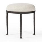 Featuring Corinne Crete Pebble Accent Stool by Four Hands at Amethyst Home. Work midcentury vibes into any space with a pared-back accent stool that doubles as a cocktail ottoman. Wrough iron legs finished in a hammered bronze pair with a simple rounded seat upholstered in a texture-rich fabric, with S-spring suspension for comfort and structure.Overal. Amethyst Home provides interior design, new home construction design consulting, vintage area rugs, and lighting in the Salt Lake City metro area.