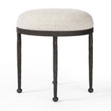 Featuring Corinne Crete Pebble Accent Stool by Four Hands at Amethyst Home. Work midcentury vibes into any space with a pared-back accent stool that doubles as a cocktail ottoman. Wrough iron legs finished in a hammered bronze pair with a simple rounded seat upholstered in a texture-rich fabric, with S-spring suspension for comfort and structure.Overal. Amethyst Home provides interior design, new home construction design consulting, vintage area rugs, and lighting in the Salt Lake City metro area.