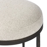 Featuring Corinne Crete Pebble Accent Stool by Four Hands at Amethyst Home. Work midcentury vibes into any space with a pared-back accent stool that doubles as a cocktail ottoman. Wrough iron legs finished in a hammered bronze pair with a simple rounded seat upholstered in a texture-rich fabric, with S-spring suspension for comfort and structure.Overall Dim. Amethyst Home provides interior design, new home construction design consulting, vintage area rugs, and lighting in the San Diego metro area.
