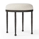 Featuring Corinne Crete Pebble Accent Stool by Four Hands at Amethyst Home. Work midcentury vibes into any space with a pared-back accent stool that doubles as a cocktail ottoman. Wrough iron legs finished in a hammered bronze pair with a simple rounded seat upholstered in a texture-rich fabric, with S-spring suspension for comfort and structure.Overall. Amethyst Home provides interior design, new home construction design consulting, vintage area rugs, and lighting in the Winter Garden metro area.