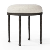 Featuring Corinne Crete Pebble Accent Stool by Four Hands at Amethyst Home. Work midcentury vibes into any space with a pared-back accent stool that doubles as a cocktail ottoman. Wrough iron legs finished in a hammered bronze pair with a simple rounded seat upholstered in a texture-rich fabric, with S-spring suspension for comfort and structure.Overall. Amethyst Home provides interior design, new home construction design consulting, vintage area rugs, and lighting in the Winter Garden metro area.