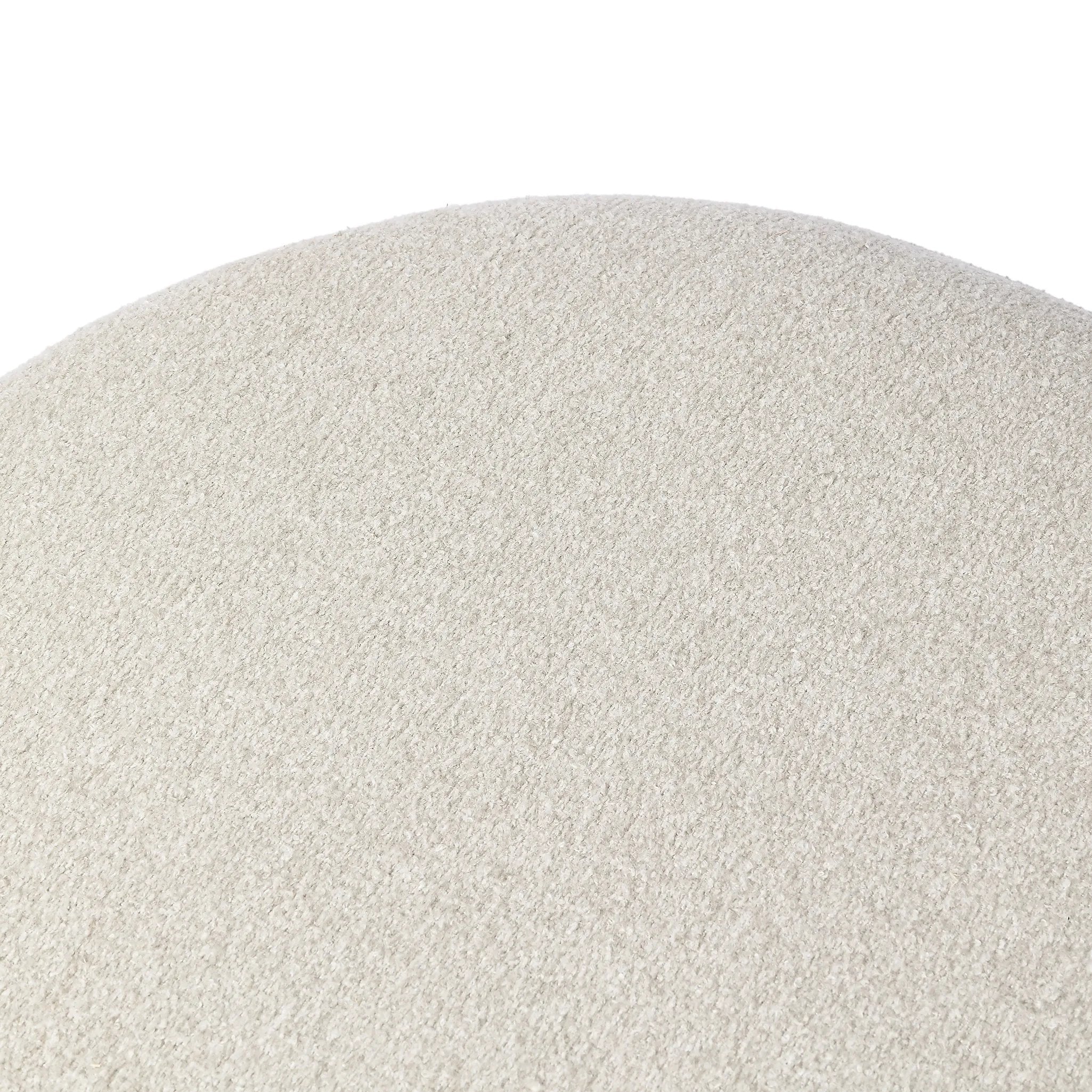 Featuring Corinne Crete Pebble Cocktail Ottoman by Four Hands at Amethyst Home. Place this round ottoman just about anywhere for a subtle retro vibe. Upholstered in a faux Mongolian shearling with a high pile fur. Parawood legs are wirebrushed for a warm, vintage feel.Overall Dimensions: 65.00"w x 35.00"d x 16.00"hWeight : 70.55 lbsMaterials: 100% Harmolan . Amethyst Home provides interior design, new home construction design consulting, vintage area rugs, and lighting in the Calabasas metro area.