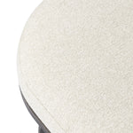 Featuring Corinne Crete Pebble Cocktail Ottoman by Four Hands at Amethyst Home. Place this round ottoman just about anywhere for a subtle retro vibe. Upholstered in a faux Mongolian shearling with a high pile fur. Parawood legs are wirebrushed for a warm, vintage feel.Overall Dimensions: 65.00"w x 35.00"d x 16.00"hWeight : 70.55 lbsMaterials: 100% Harmolan . Amethyst Home provides interior design, new home construction design consulting, vintage area rugs, and lighting in the Charlotte metro area.