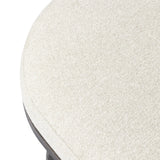 Featuring Corinne Crete Pebble Cocktail Ottoman by Four Hands at Amethyst Home. Place this round ottoman just about anywhere for a subtle retro vibe. Upholstered in a faux Mongolian shearling with a high pile fur. Parawood legs are wirebrushed for a warm, vintage feel.Overall Dimensions: 65.00"w x 35.00"d x 16.00"hWeight : 70.55 lbsMaterials: 100% Harmolan . Amethyst Home provides interior design, new home construction design consulting, vintage area rugs, and lighting in the Charlotte metro area.