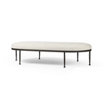 Featuring Corinne Crete Pebble Cocktail Ottoman by Four Hands at Amethyst Home. Place this round ottoman just about anywhere for a subtle retro vibe. Upholstered in a faux Mongolian shearling with a high pile fur. Parawood legs are wirebrushed for a warm, vintage feel.Overall Dimensions: 65.00"w x 35.00"d x 16.00"hWeight : 70.55 lbsMaterials: 100% Harmol. Amethyst Home provides interior design, new home construction design consulting, vintage area rugs, and lighting in the Laguna Beach metro area.