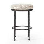 Featuring Corinne Ivan Stone Bar + Counter Stool by Four Hands at Amethyst Home. Hammered bronze legs with ball-shaped foot details elevate this simply shaped counter stool. A round, cushioned seat in a heavy boucle-like fabric finishes this counter-height stool's clean, inviting look.BarOverall Dimensions: 17.00"w x 17.00"d x 31.25"hWeight: 32.19 lbsCounte. Amethyst Home provides interior design, new home construction design consulting, vintage area rugs, and lighting in the Nashville metro area.