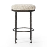 Featuring Corinne Ivan Stone Bar + Counter Stool by Four Hands at Amethyst Home. Hammered bronze legs with ball-shaped foot details elevate this simply shaped counter stool. A round, cushioned seat in a heavy boucle-like fabric finishes this counter-height stool's clean, inviting look.BarOverall Dimensions: 17.00"w x 17.00"d x 31.25"hWeight: 32.19 lbsCounte. Amethyst Home provides interior design, new home construction design consulting, vintage area rugs, and lighting in the Nashville metro area.
