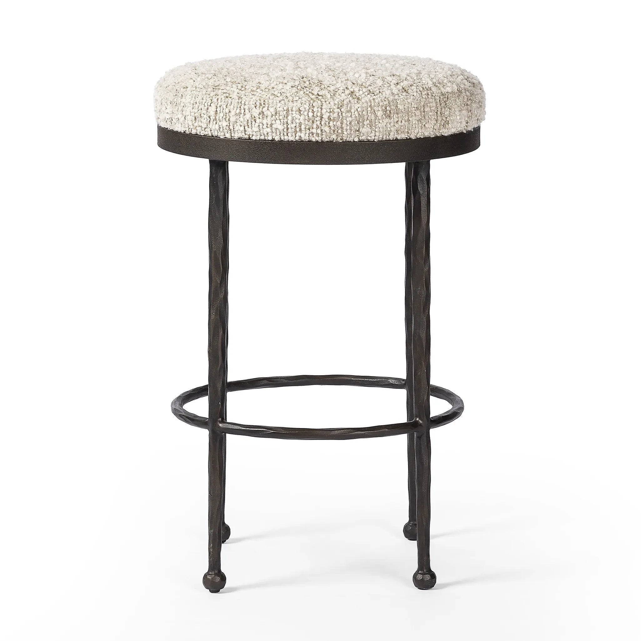 Featuring Corinne Ivan Stone Bar + Counter Stool by Four Hands at Amethyst Home. Hammered bronze legs with ball-shaped foot details elevate this simply shaped counter stool. A round, cushioned seat in a heavy boucle-like fabric finishes this counter-height stool's clean, inviting look.BarOverall Dimensions: 17.00"w x 17.00"d x 31.25"hWeight: 32.19 lbsCounte. Amethyst Home provides interior design, new home construction design consulting, vintage area rugs, and lighting in the Nashville metro area.