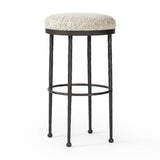 Featuring Corinne Ivan Stone Bar + Counter Stool by Four Hands at Amethyst Home. Hammered bronze legs with ball-shaped foot details elevate this simply shaped counter stool. A round, cushioned seat in a heavy boucle-like fabric finishes this counter-height stool's clean, inviting look.BarOverall Dimensions: 17.00"w x 17.00"d x 31.25"hWeight: 32.19 lbsCounterOve. Amethyst Home provides interior design, new home construction design consulting, vintage area rugs, and lighting in the Omaha metro area.