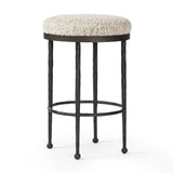 Featuring Corinne Ivan Stone Bar + Counter Stool by Four Hands at Amethyst Home. Hammered bronze legs with ball-shaped foot details elevate this simply shaped counter stool. A round, cushioned seat in a heavy boucle-like fabric finishes this counter-height stool's clean, inviting look.BarOverall Dimensions: 17.00"w x 17.00"d x 31.25"hWeight: 32.19 lbsCounterO. Amethyst Home provides interior design, new home construction design consulting, vintage area rugs, and lighting in the Seattle metro area.