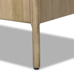 Add storage to your dining space, plus a look of beautiful simplicity. Crafted of light natural oak, with cylindrical legs and rounded detailing throughout the case. Spacious inside awaits storage of favorite table linens, serveware and more. Amethyst Home provides interior design, new home construction design consulting, vintage area rugs, and lighting in the Laguna Beach metro area.