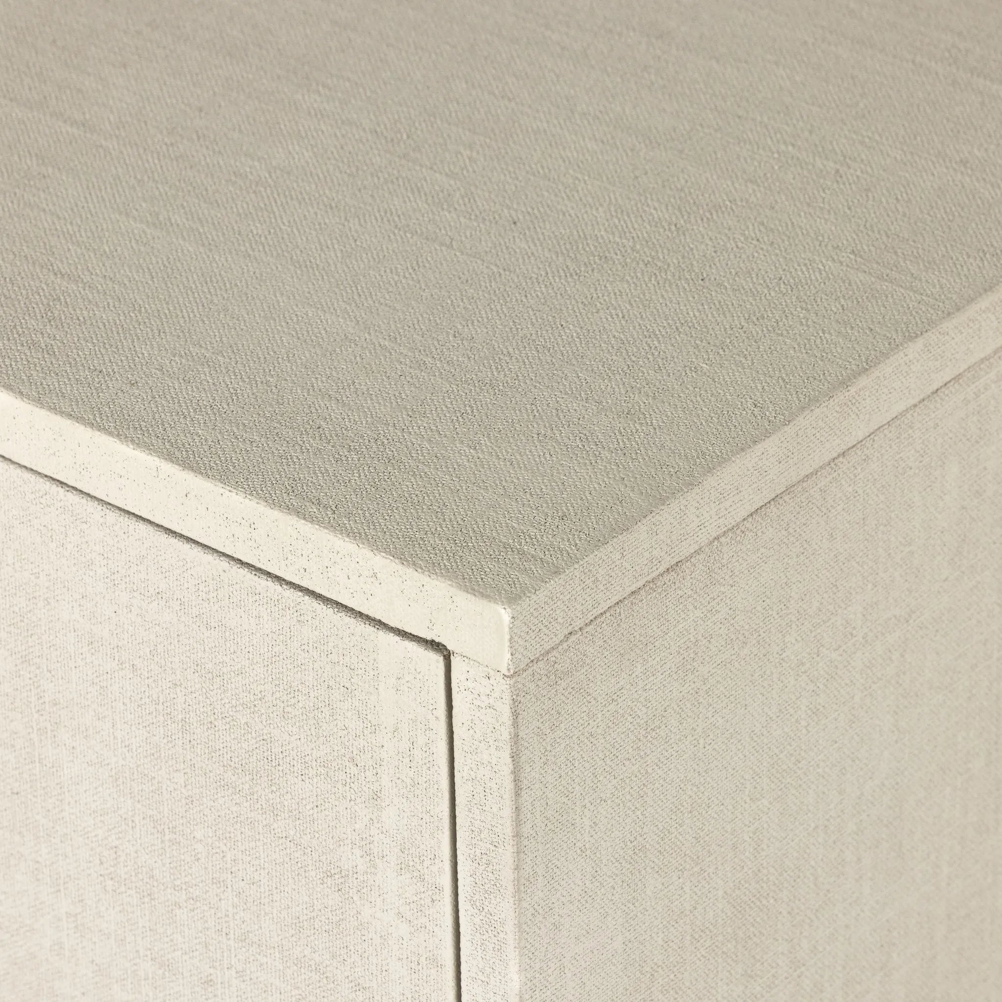 Talk about novelty. Made from painted linen in a light ivory, arched legs soften otherwise clean, modern shaping. Finished in