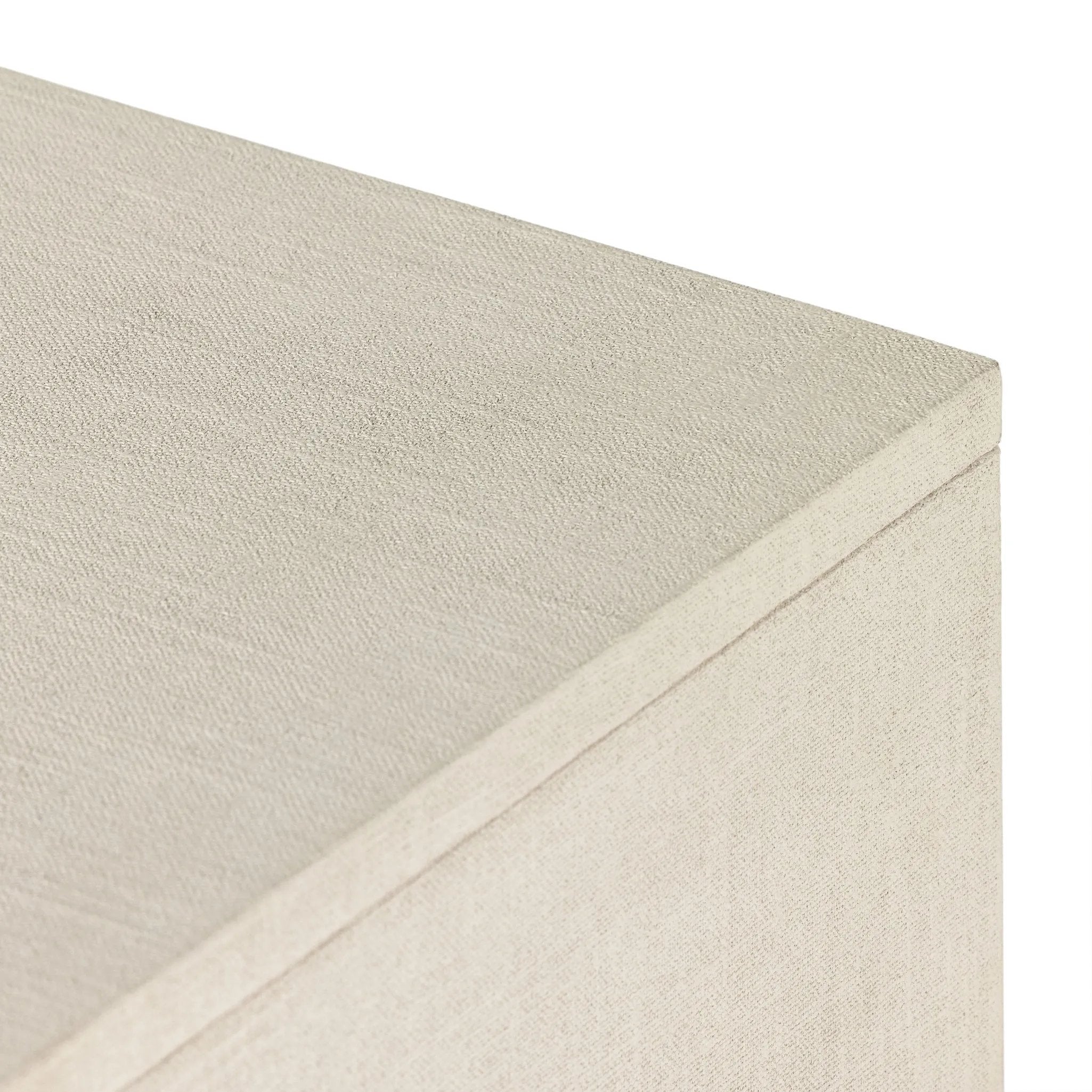 Talk about novelty. Made from painted linen in a light ivory, arched legs soften otherwise clean, modern shaping. Finished in