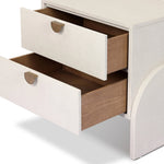 Talk about novelty. Made from painted linen in a light ivory, arched legs soften otherwise clean, modern shaping. Two drawers bring storage to the bedside while half-moon iron hardware adds a hint of art deco style Amethyst Home provides interior design, new home construction design consulting, vintage area rugs, and lighting in the Calabasas metro area.