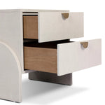 Talk about novelty. Made from painted linen in a light ivory, arched legs soften otherwise clean, modern shaping. Two drawers bring storage to the bedside while half-moon iron hardware adds a hint of art deco style Amethyst Home provides interior design, new home construction design consulting, vintage area rugs, and lighting in the Los Angeles metro area.