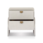Talk about novelty. Made from painted linen in a light ivory, arched legs soften otherwise clean, modern shaping. Two drawers bring storage to the bedside while half-moon iron hardware adds a hint of art deco style Amethyst Home provides interior design, new home construction design consulting, vintage area rugs, and lighting in the Miami metro area.