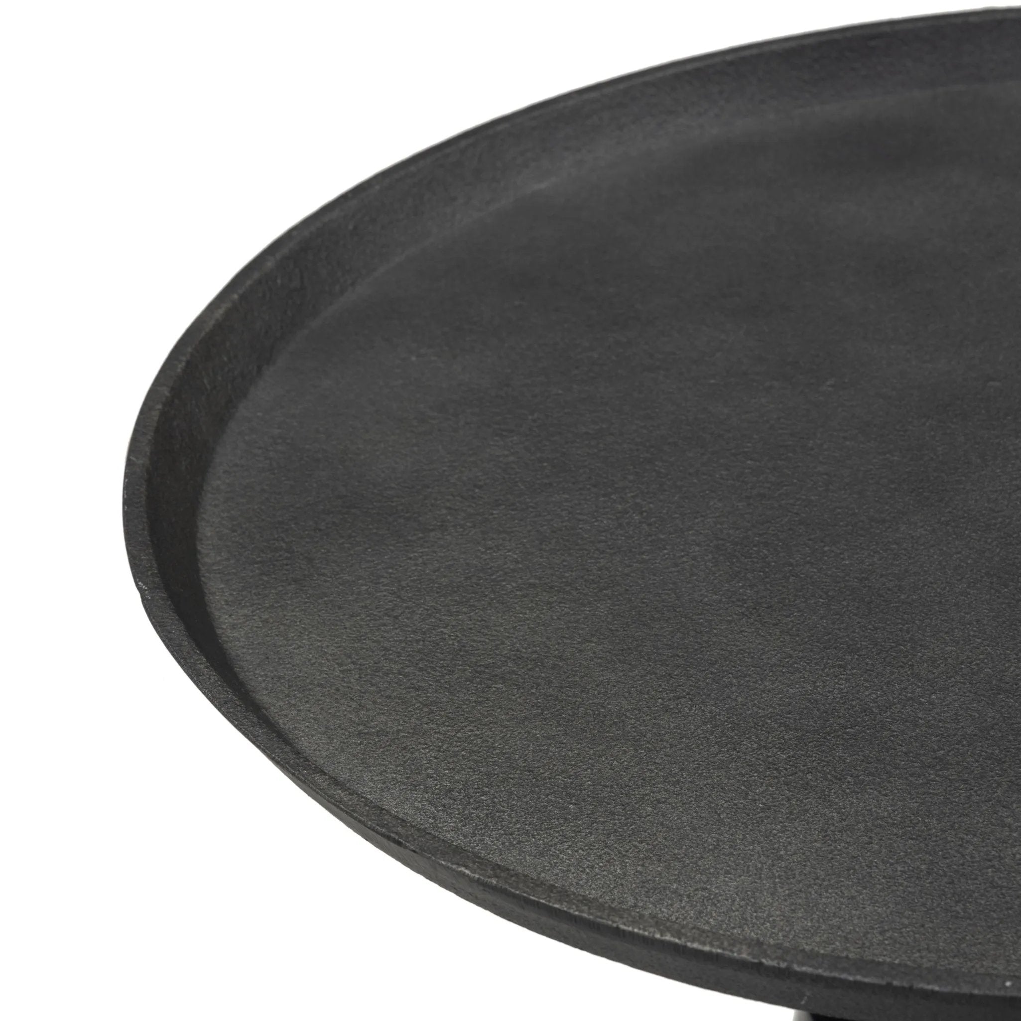 Simply sophisticated. Finished in a polished black, a solid turned marble base supports a tray-style tabletop of hammered grey aluminum, spurring a luxe look with natural movement Amethyst Home provides interior design, new home construction design consulting, vintage area rugs, and lighting in the Austin metro area.