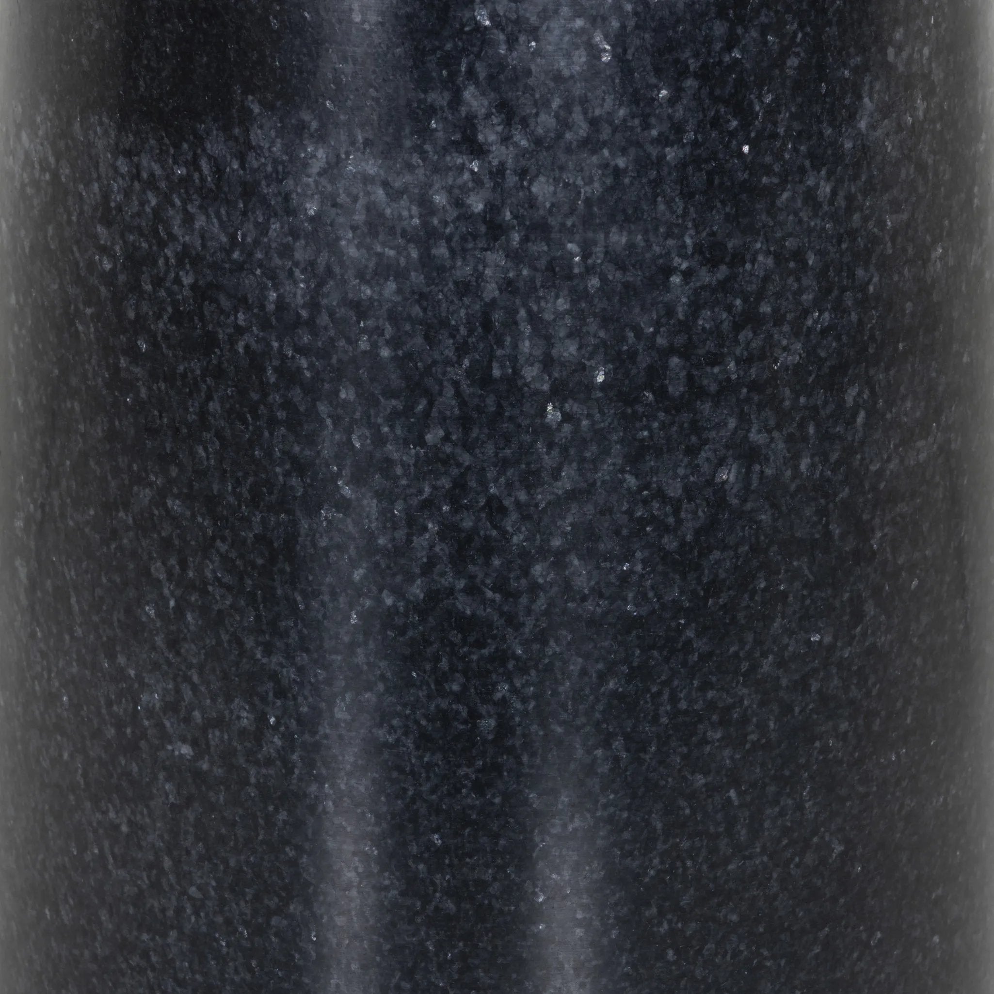 Simply sophisticated. Finished in a polished black, a solid turned marble base supports a tray-style tabletop of hammered grey aluminum, spurring a luxe look with natural movement Amethyst Home provides interior design, new home construction design consulting, vintage area rugs, and lighting in the Seattle metro area.