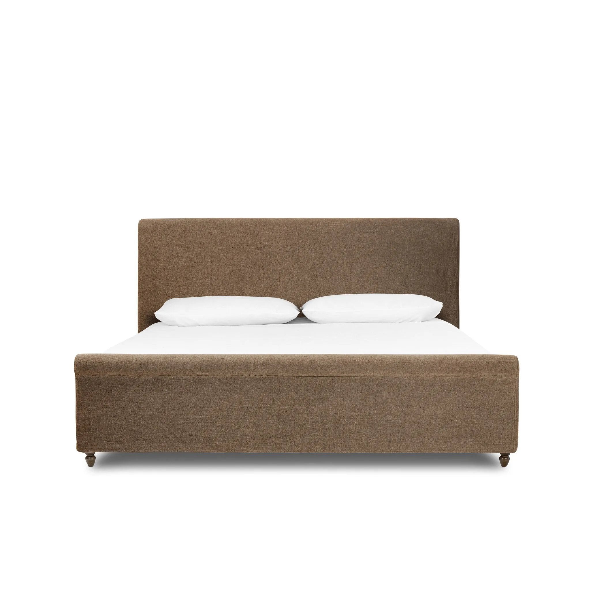 This heritage-style bed reimagines the classic sleigh silhouette. Coffee-brown, linen-like fabric slipcover is both removable and washable for practicality. Turned feet in brown parawood peek from under the slip, grounding the bed's stately charm. A design collaboration by Amber Lewis and Four Hands. Amethyst Home provides interior design, new home construction design consulting, vintage area rugs, and lighting in the Monterey metro area.