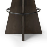 Featuring Damon Sapphire Khaki  Swivel Bar + Counter Stool by Four Hands at Amethyst Home. Large angular panels merge to form a geometrically inspired base in this modern counter stool. The circle metal ring around the base serves as a footrest, while the round upholstered cushion provides comfortable seating. The 360-degree swivel function adds versatility. Amethyst Home provides interior design, new home construction design consulting, vintage area rugs, and lighting in the Calabasas metro area.