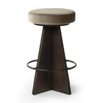 Featuring Damon Sapphire Khaki  Swivel Bar + Counter Stool by Four Hands at Amethyst Home. Large angular panels merge to form a geometrically inspired base in this modern counter stool. The circle metal ring around the base serves as a footrest, while the round upholstered cushion provides comfortable seating. The 360-degree swivel function adds versatility, an. Amethyst Home provides interior design, new home construction design consulting, vintage area rugs, and lighting in the Tampa metro area.