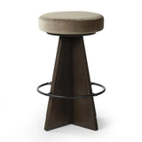 Featuring Damon Sapphire Khaki  Swivel Bar + Counter Stool by Four Hands at Amethyst Home. Large angular panels merge to form a geometrically inspired base in this modern counter stool. The circle metal ring around the base serves as a footrest, while the round upholstered cushion provides comfortable seating. The 360-degree swivel function adds versatility, an. Amethyst Home provides interior design, new home construction design consulting, vintage area rugs, and lighting in the Tampa metro area.