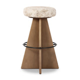 Large angular panels merge to form a geometrically inspired base in this modern counter stool. The circle metal ring around the base serves as a footrest, while the round upholstered cushion provides comfortable seating. The 360-degree swivel function adds versatility, and the combination of wood, metal, and fabric evoke a mixed material moment Amethyst Home provides interior design, new home construction design consulting, vintage area rugs, and lighting in the Alpharetta metro area.