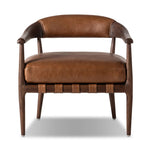 Featuring Dane Sonoma Chestnut Chair by Four Hands at Amethyst Home. Safari styling is brought to modern speed on this vintage-inspired chair. Its solid wood frame features a webbed seating structure that brings a sink-in feel to the entire piece. The upholstered back, strap details and loose cushion are finished in carbon neutral, vegetable-tanned leather pro. Amethyst Home provides interior design, new home construction design consulting, vintage area rugs, and lighting in the Dallas metro area.