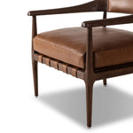 Featuring Dane Sonoma Chestnut Chair by Four Hands at Amethyst Home. Safari styling is brought to modern speed on this vintage-inspired chair. Its solid wood frame features a webbed seating structure that brings a sink-in feel to the entire piece. The upholstered back, strap details and loose cushion are finished in carbon neutral, vegetable-tanned leather proc. Amethyst Home provides interior design, new home construction design consulting, vintage area rugs, and lighting in the Miami metro area.