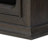 Featuring Dawes Smoked Black Oak Cabinet by Four Hands at Amethyst Home. Work the timeless charm of a vintage find into your collection. Smoked black oak cabinetry features softened mullions and rounded glass panels, with aged bronze barrel hinges and finial detailing. Generous storage and display options empower you to create a space that tells your story.Ov. Amethyst Home provides interior design, new home construction design consulting, vintage area rugs, and lighting in the Houston metro area.