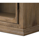 Featuring Dawes Weathered Oak Cabinet by Four Hands at Amethyst Home. Work the timeless charm of a vintage find into your collection. Weathered oak cabinetry features softened mullions and rounded glass panels, with aged bronze barrel hinges and finial detailing. Generous storage and display options  empower you to create a space that tells your story.Overall D. Amethyst Home provides interior design, new home construction design consulting, vintage area rugs, and lighting in the Tampa metro area.