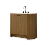 Sleek and softly curved, this pill-shaped bath vanity pairs a monochromatic base with a natural marble top. Complemented by rounded hardware and a set back base board, with adjustable and removable shelves inside for ample storage. Finished with a bath-safe sealant for moisture resistance. Amethyst Home provides interior design, new home construction design consulting, vintage area rugs, and lighting in the Laguna Beach metro area.