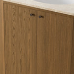 Sleek and softly curved, this pill-shaped bath vanity pairs a monochromatic base with a natural marble top. Complemented by rounded hardware and a set back base board, with adjustable and removable shelves inside for ample storage. Finished with a bath-safe sealant for moisture resistance. Amethyst Home provides interior design, new home construction design consulting, vintage area rugs, and lighting in the Nashville metro area.