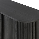 Crafted from desert oak solids and veneers with a plinth-style base, rounded sides and linear reeding, this sideboard exudes midcentury vibes. Fully finished interior and shelves for quality detailing inside and out.As enthusiasts of luxe style at Amethyst, we love the warm modern inspired Delphi Media Console - Cerused Black Oak. Amethyst Home provides interior design, new home construction design consulting, vintage area rugs, and lighting in the Los Angeles metro area.