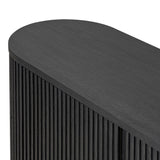 Crafted from desert oak solids and veneers with a plinth-style base, rounded sides and linear reeding, this sideboard exudes midcentury vibes. Fully finished interior and shelves for quality detailing inside and out.As enthusiasts of luxe style at Amethyst, we love the warm modern inspired Delphi Media Console - Cerused Black Oak. Amethyst Home provides interior design, new home construction design consulting, vintage area rugs, and lighting in the Omaha metro area.