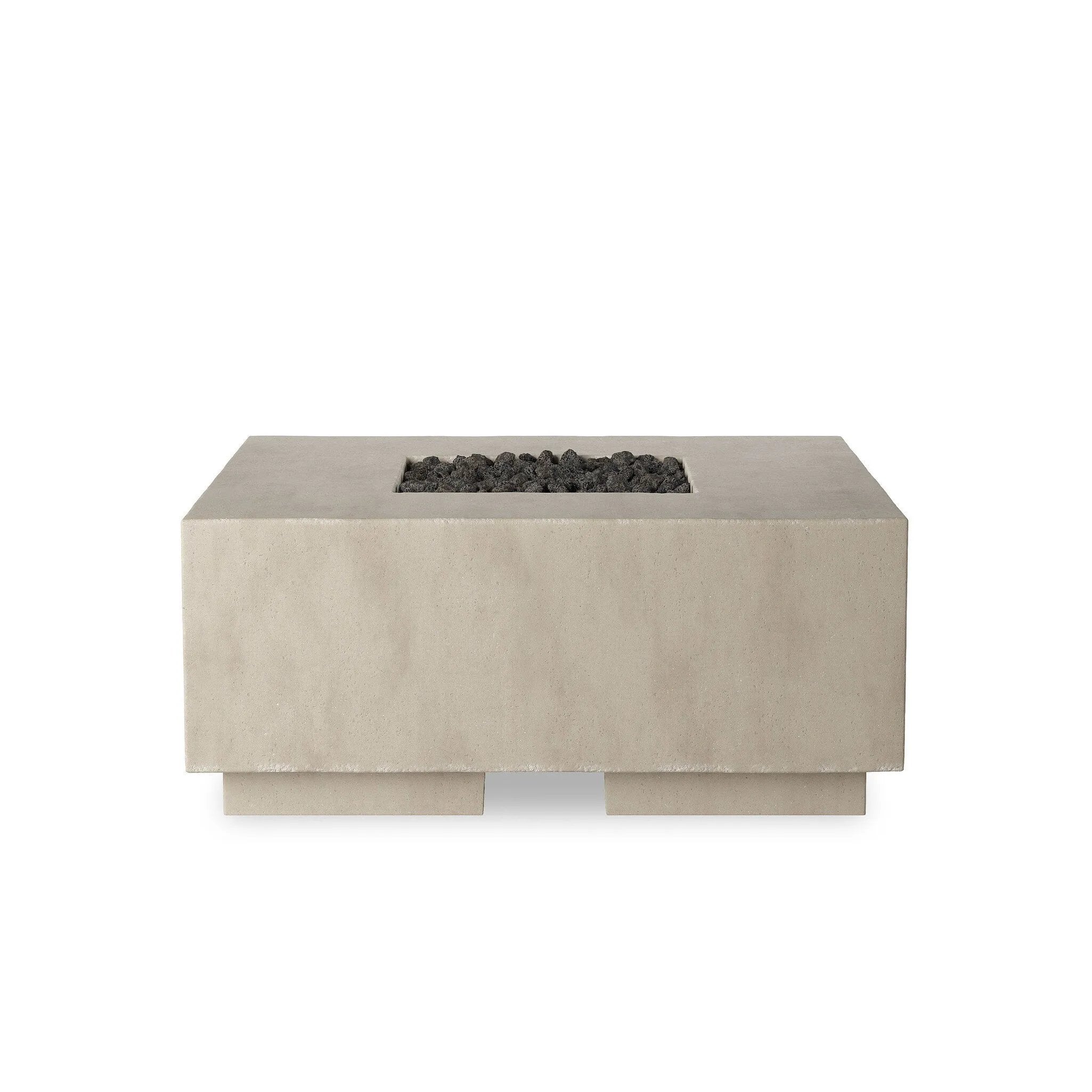 This outdoor fire table is a welcoming centerpiece designed for gathering. Made from glass-reinforced concrete, each piece is naturally finished with subtle tones of grey and cream. The monolithic shape is completed with lavastones in the center, bringing together a bold, monochromatic look. Amethyst Home provides interior design, new home construction design consulting, vintage area rugs, and lighting in the Alpharetta metro area.