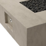 This outdoor fire table is a welcoming centerpiece designed for gathering. Made from glass-reinforced concrete, each piece is naturally finished with subtle tones of grey and cream. The monolithic shape is completed with lavastones in the center, bringing together a bold, monochromatic look. Amethyst Home provides interior design, new home construction design consulting, vintage area rugs, and lighting in the Omaha metro area.