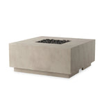 This outdoor fire table is a welcoming centerpiece designed for gathering. Made from glass-reinforced concrete, each piece is naturally finished with subtle tones of grey and cream. The monolithic shape is completed with lavastones in the center, bringing together a bold, monochromatic look. Amethyst Home provides interior design, new home construction design consulting, vintage area rugs, and lighting in the Seattle metro area.