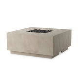 This outdoor fire table is a welcoming centerpiece designed for gathering. Made from glass-reinforced concrete, each piece is naturally finished with subtle tones of grey and cream. The monolithic shape is completed with lavastones in the center, bringing together a bold, monochromatic look. Amethyst Home provides interior design, new home construction design consulting, vintage area rugs, and lighting in the Seattle metro area.